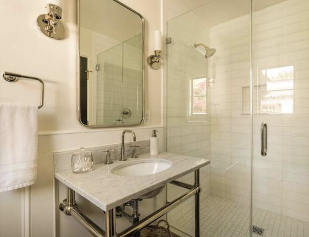 McCadden Residence guest bathroom with marble console sink