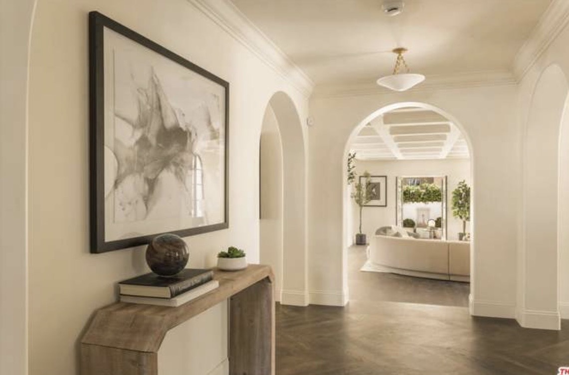 McCadden Residence hallway with artwork and console