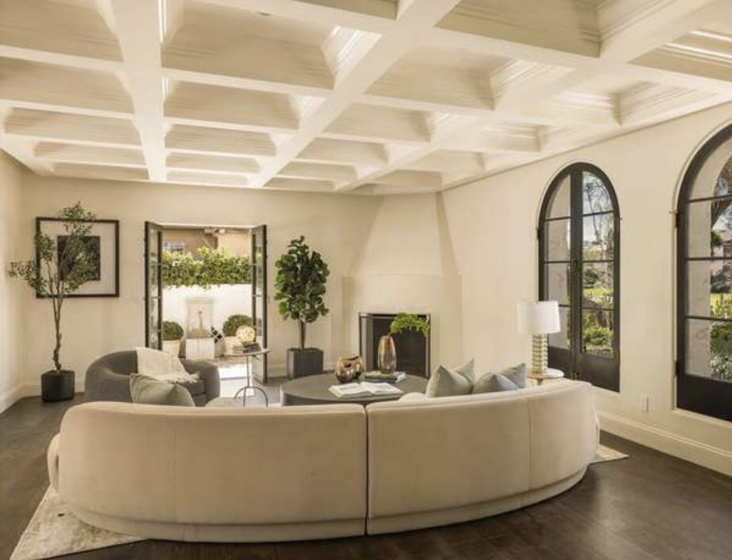 McCadden Residence living room with curved sofa and coffered ceiling