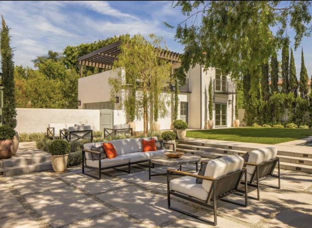 McCadden Residence outdoor seating with pergola and lawn