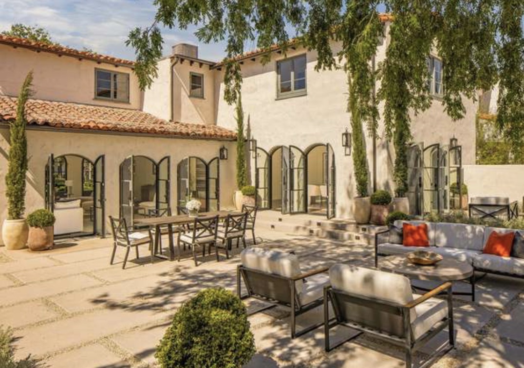 McCadden Residence patio with arched steel doors and outdoor seating