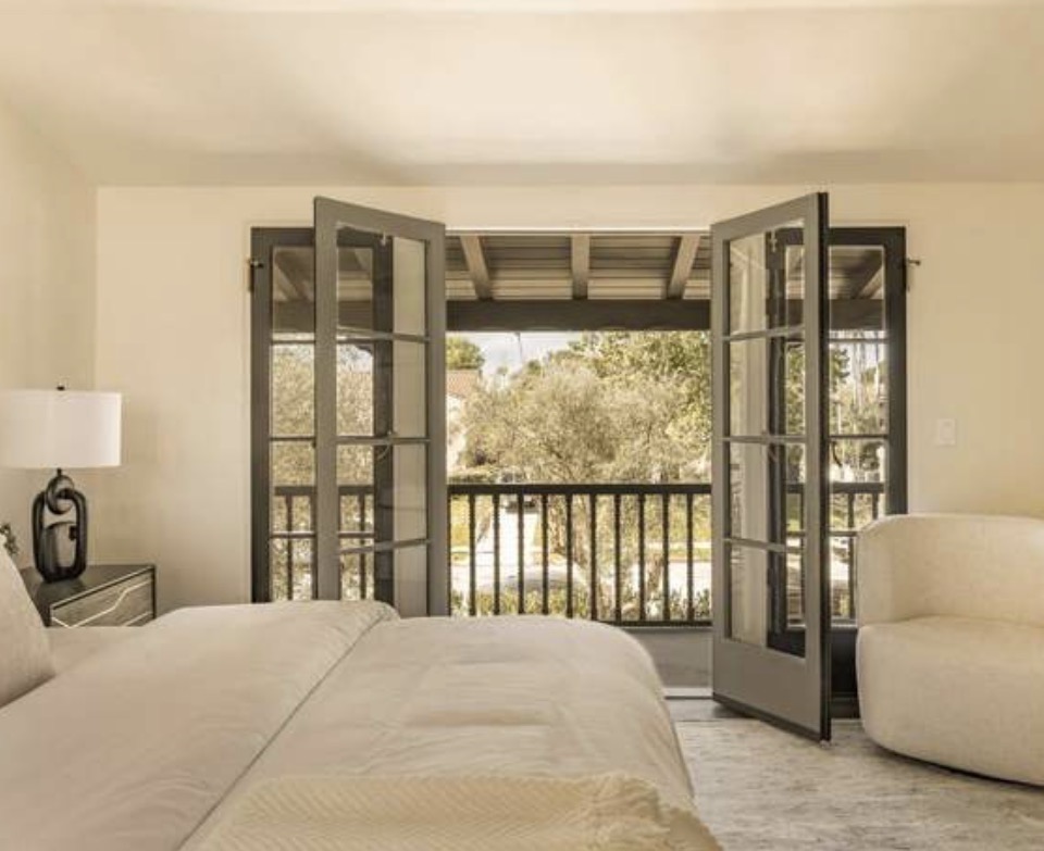 McCadden Residence primary bedroom with French doors to balcony